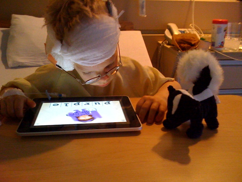 Scott tries out his new iPad after cochlear implant surgery